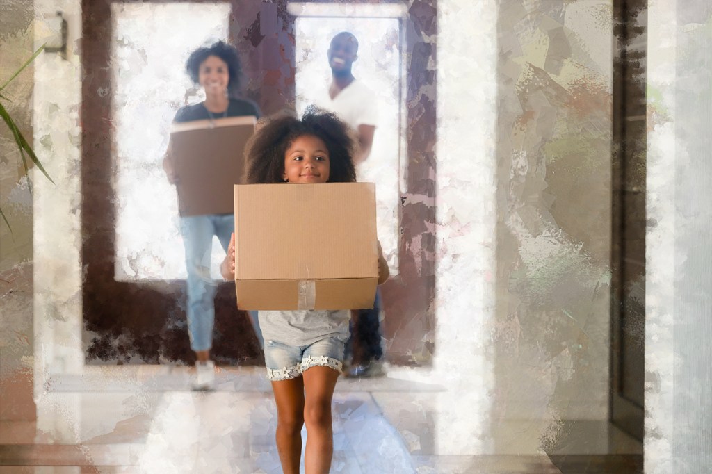 Happy family unpacking into their new home