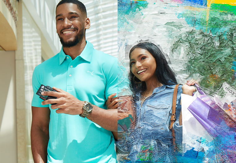 All smiles couple strolling through the mall enjoying shopping from their debt consolidation.