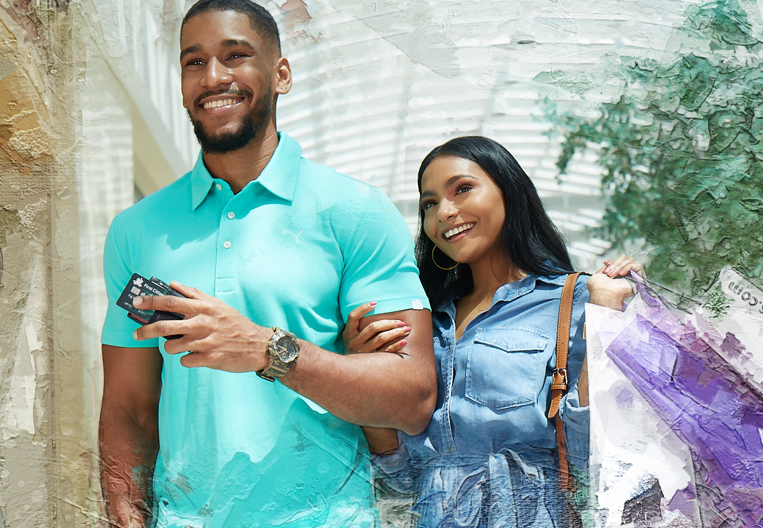 All smiles couple strolling through the mall enjoying shopping from their debt consolidation.