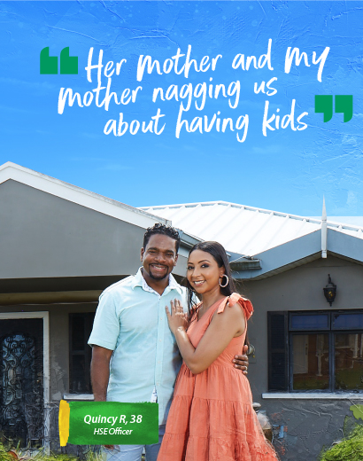 Couple standing Infront of their new home