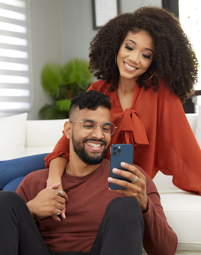 Young couple sitting in home